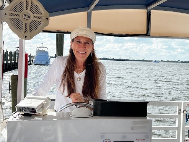 woman boat captain operating a boat